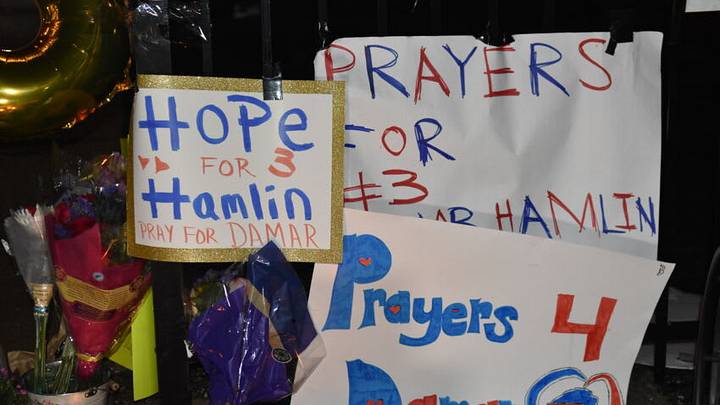 CINCINNATI, UNITED STATES - JANUARY 3: Fans gather outside the UC Medical Center for Damar Hamlin, a National Football League (NFL) player in the US, who receive medical attention after suffering from a "cardiac arrest." during a football game, in Cincinnati, United States on January 3, 2022. Damar Hamlin on Monday collapsed during a football game and is in a "critical condition." (Photo by Kyle Mazza/Anadolu Agency via Getty Images)